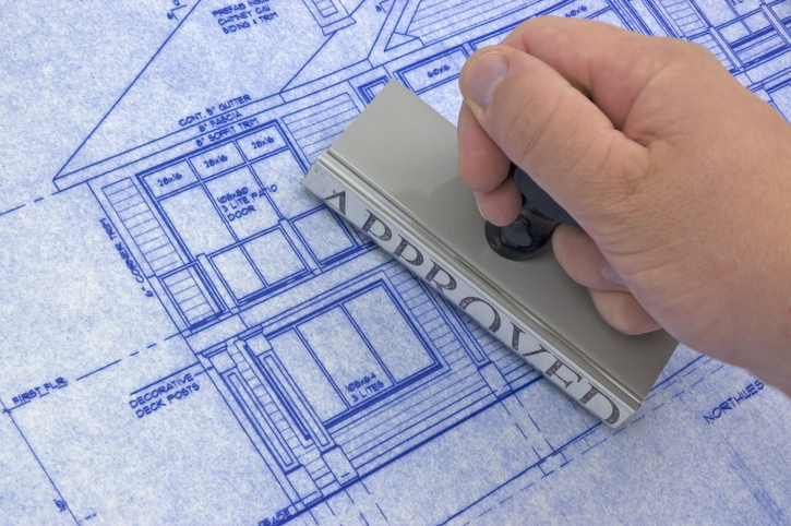 Professional building inspector examining a property structure.